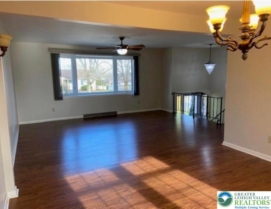 2700 Van Buren Road Easton, PA 18045 - Photo 3 of 21 a view of an empty room with wooden floor and a window