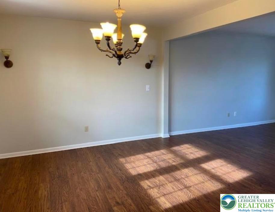 2700 Van Buren Road Easton, PA 18045 - Photo 4 of 21 a view of a room with wooden floor chandelier and a ceiling fan