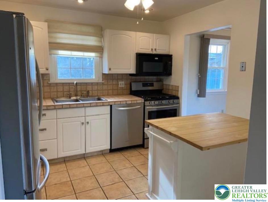 2700 Van Buren Road Easton, PA 18045 - Photo 5 of 21 a kitchen with a sink a stove and cabinets