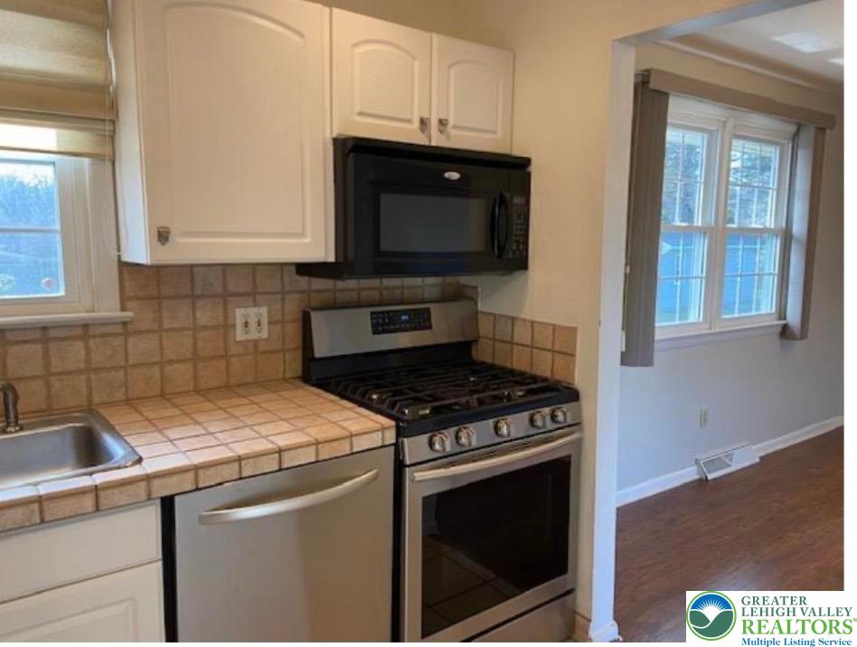 2700 Van Buren Road Easton, PA 18045 - Photo 6 of 21 a kitchen with a stove and a microwave
