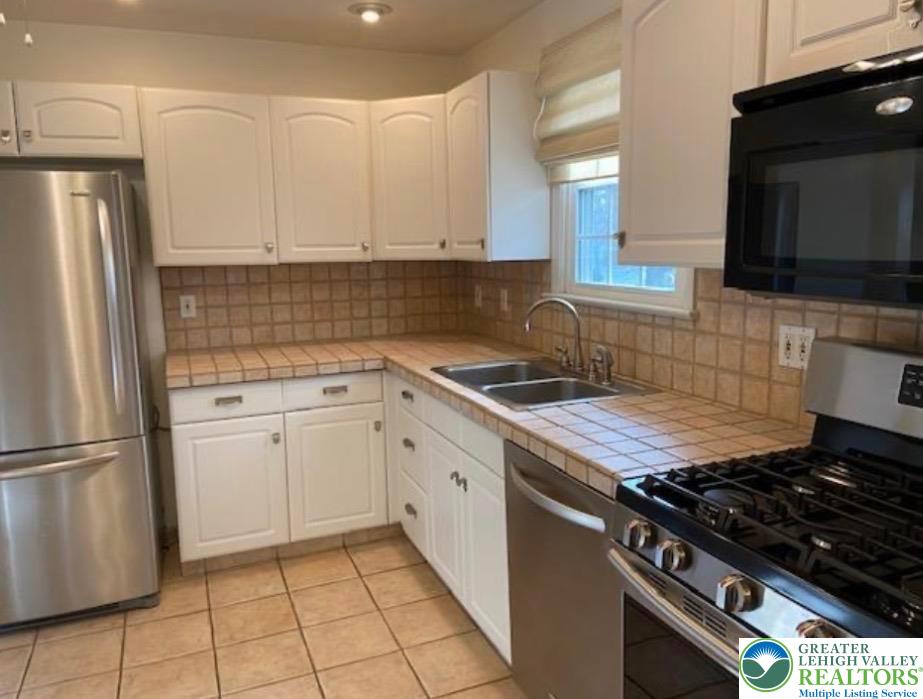 2700 Van Buren Road Easton, PA 18045 - Photo 7 of 21 a kitchen with a stove a sink and a refrigerator