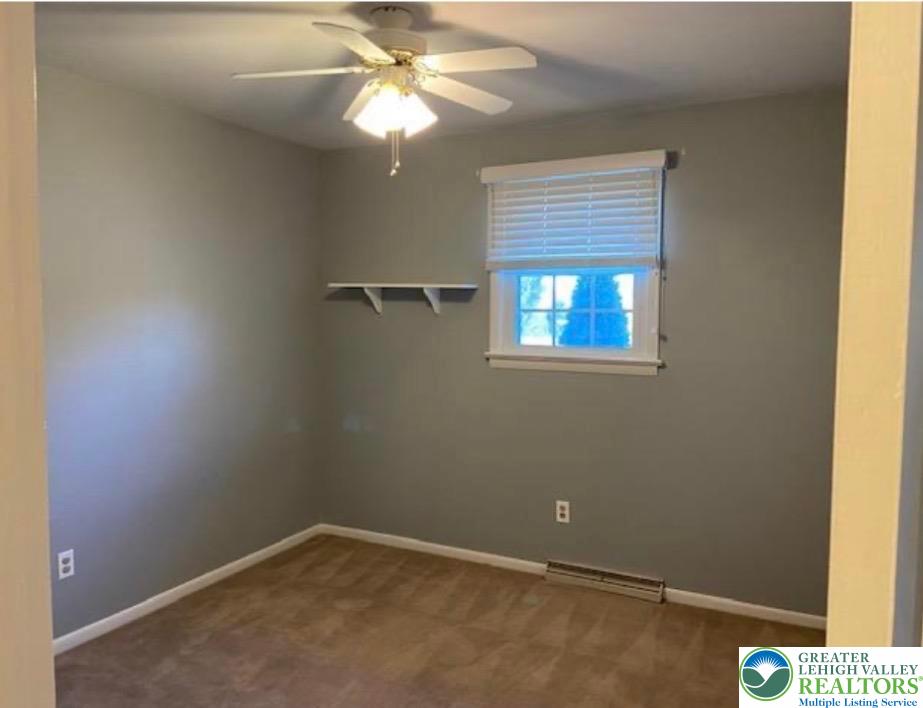2700 Van Buren Road Easton, PA 18045 - Photo 8 of 21 an empty room with a window and a fan