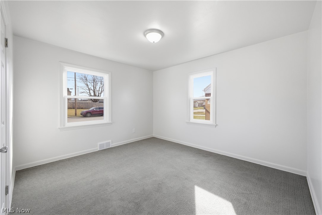 227 Wilson Street Struthers, OH 44471 - Photo 17 of 44 Spare room featuring carpet and baseboards