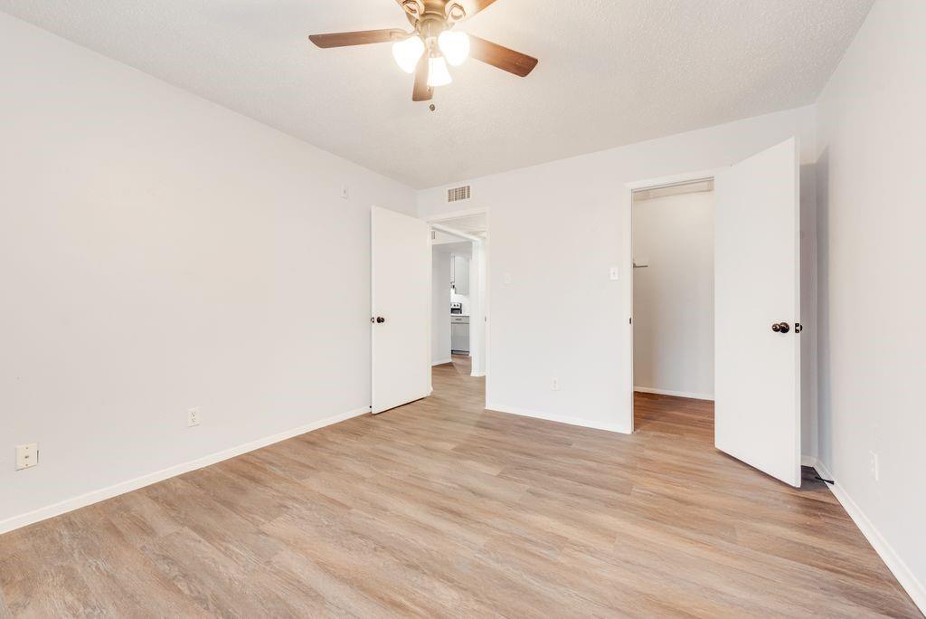 5514 Boca Raton Boulevard, Unit 438 Fort Worth, TX 76112 - Photo 11 of 25 a view of an empty room with wooden floor