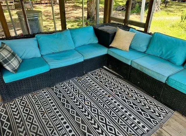 a black leather couch in front of a building