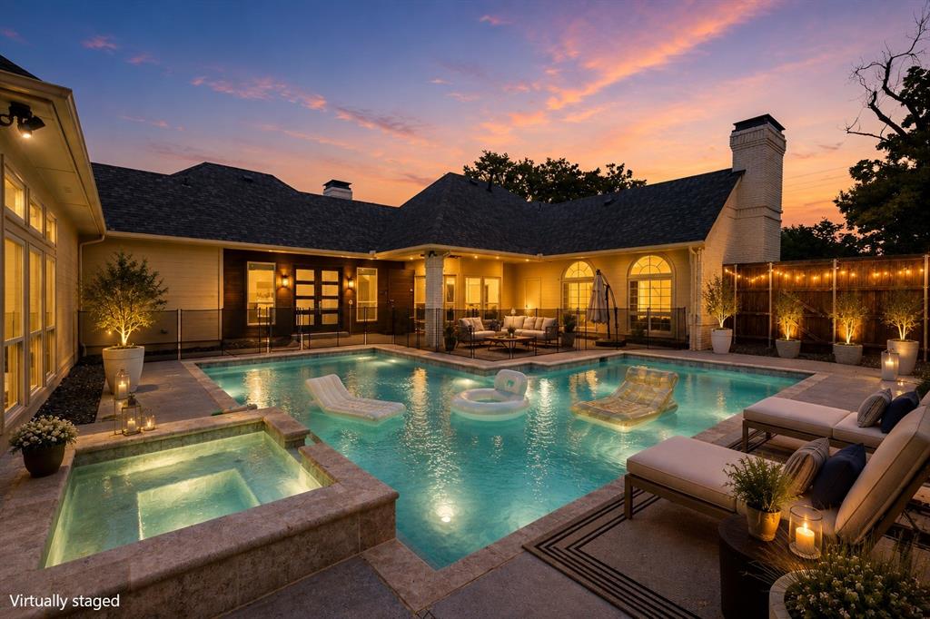 17327 Davenport Road Dallas, TX 75248 - Photo 1 of 40 a view of a swimming pool with a patio