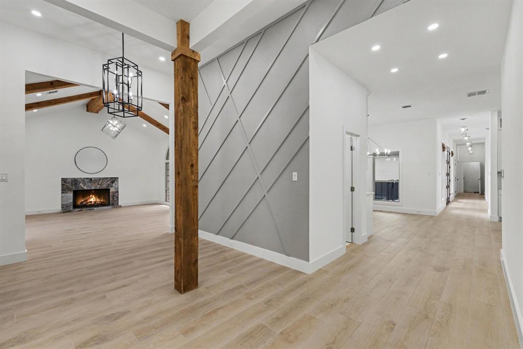 17327 Davenport Road Dallas, TX 75248 - Photo 16 of 40 a view of a hallway with wooden floor and windows
