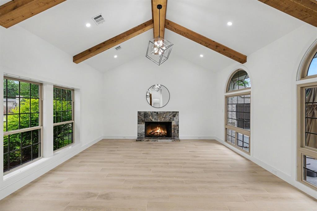 17327 Davenport Road Dallas, TX 75248 - Photo 17 of 40 a view of an entryway with a fireplace and window
