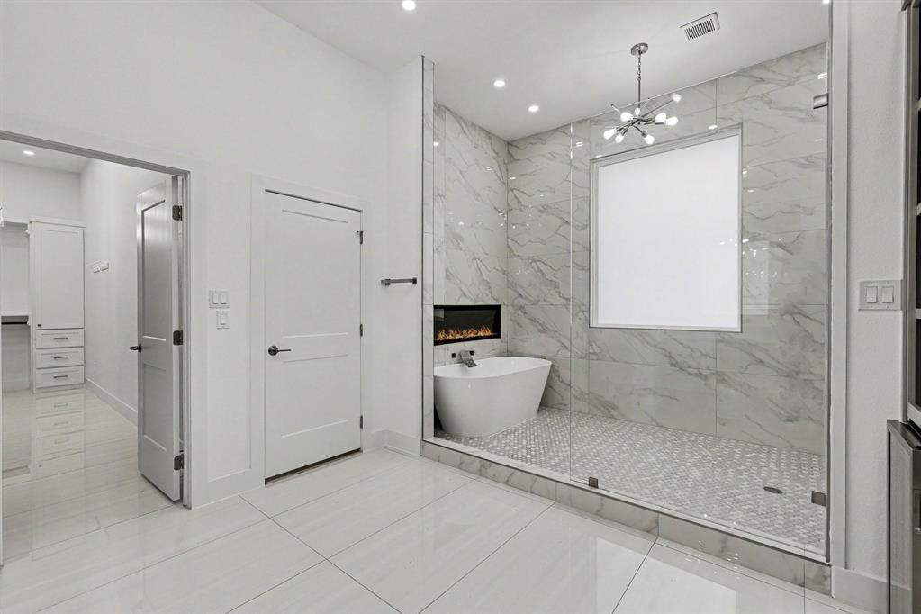 17327 Davenport Road Dallas, TX 75248 - Photo 25 of 40 a bathroom with a toilet sink and shower