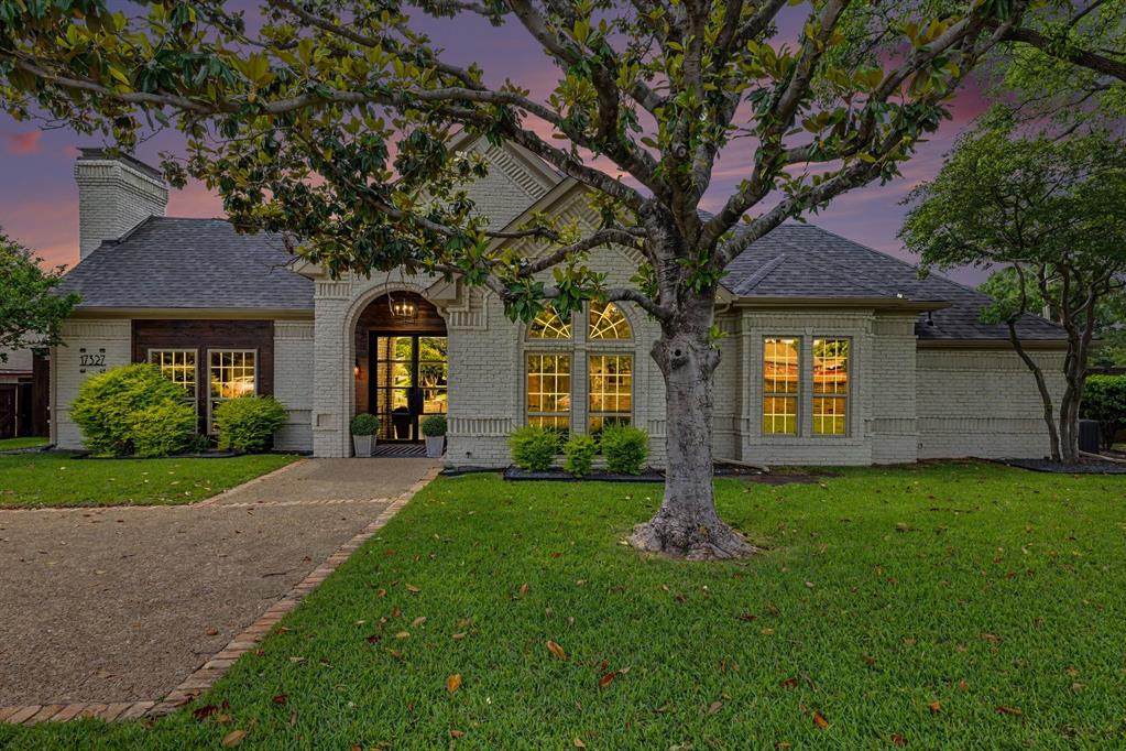 17327 Davenport Road Dallas, TX 75248 - Photo 3 of 40 a front view of a house with a yard