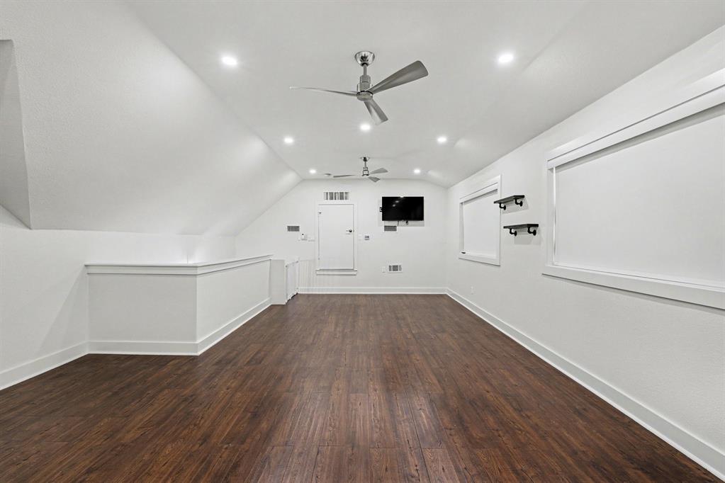 17327 Davenport Road Dallas, TX 75248 - Photo 34 of 40 a view of an empty room with wooden floor and a window