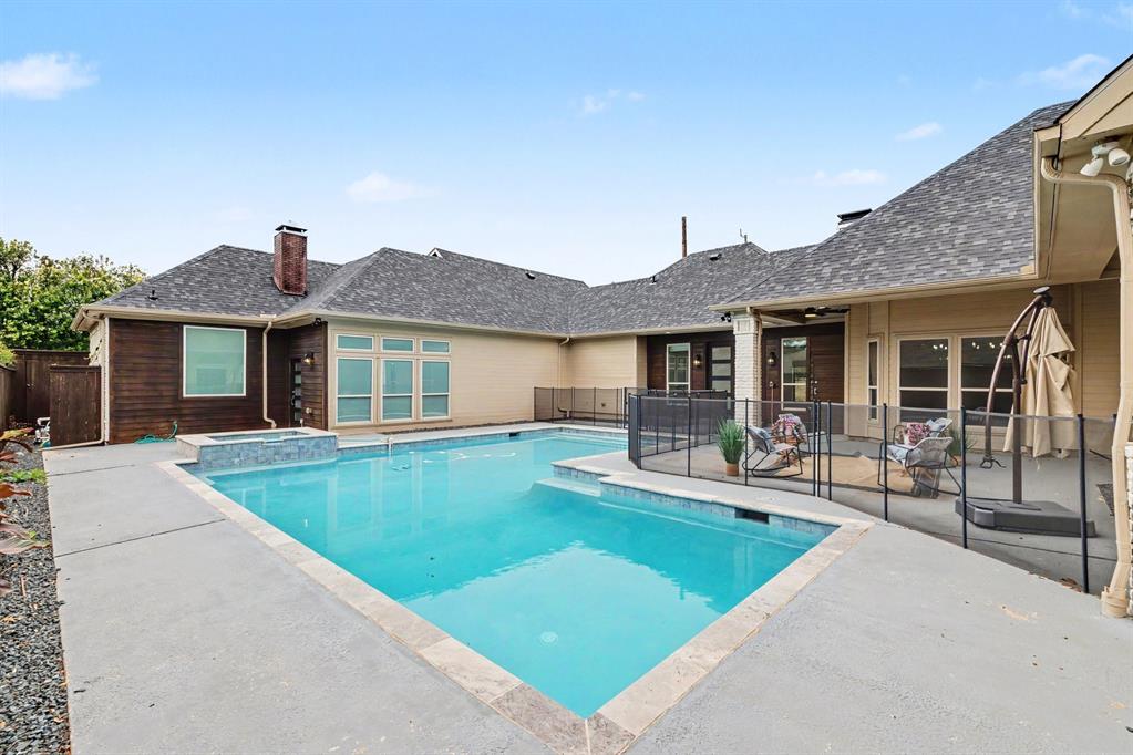 17327 Davenport Road Dallas, TX 75248 - Photo 38 of 40 a view of a house with swimming pool and sitting area