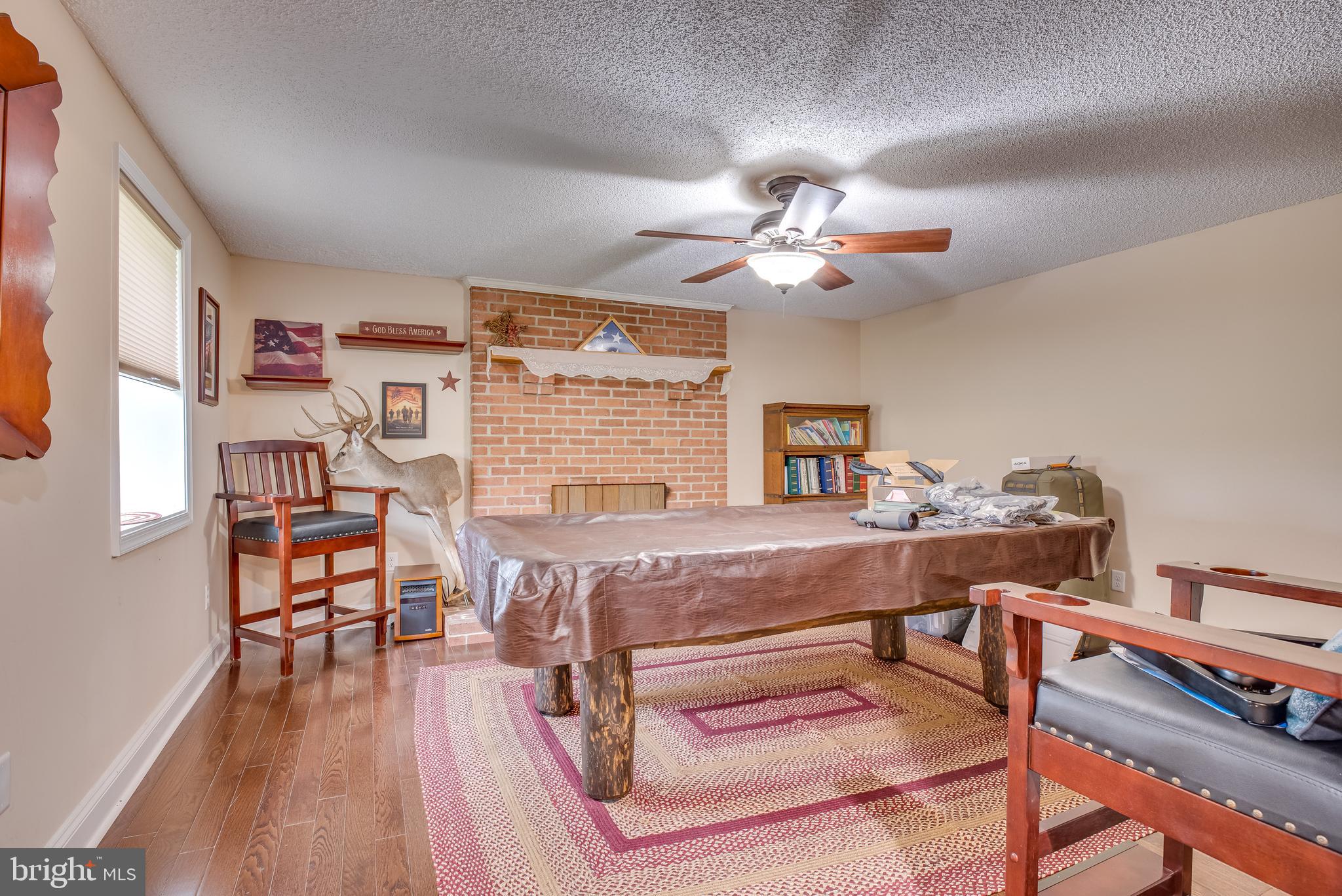1453 Reunion Corner Road Gerrardstown, WV 25420 - Photo 22 of 51 The main floor has a den with a fireplace.