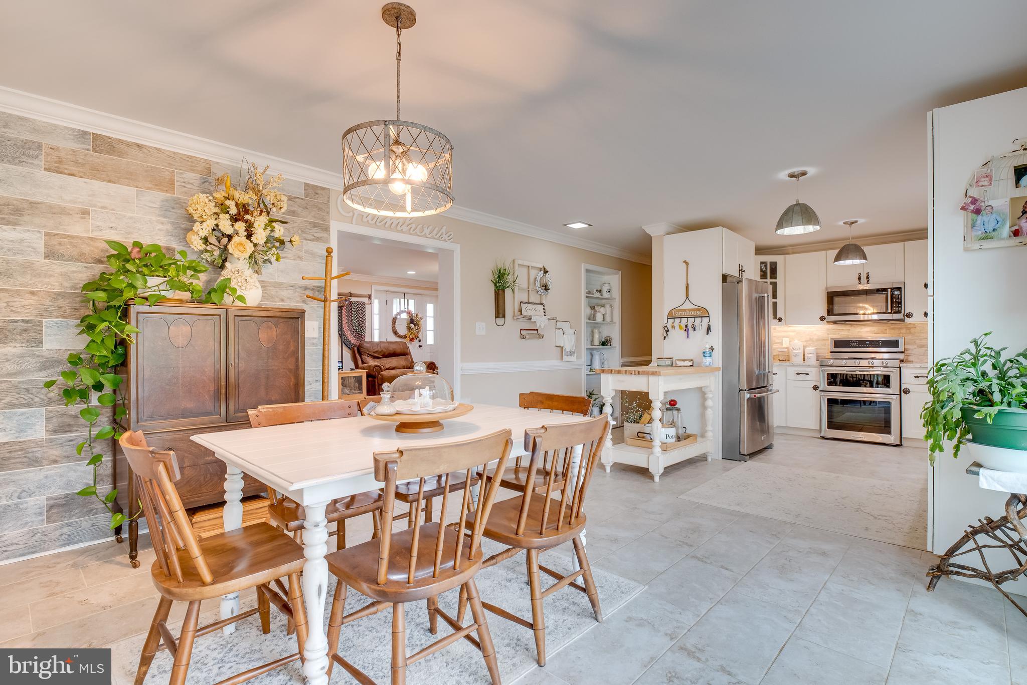 1453 Reunion Corner Road Gerrardstown, WV 25420 - Photo 8 of 51 The light flooded dining area will entice you to