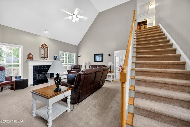 a living room with furniture and a fireplace