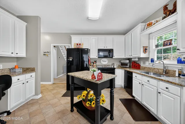a kitchen with a sink stove and refrigerator