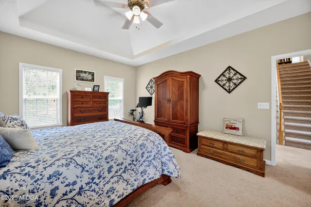 a bed room with a bed and a chandelier