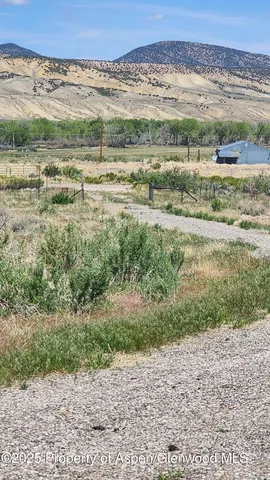 a view of a road with a mountain in the background