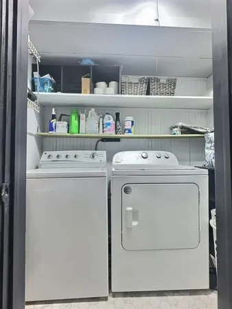 a utility room with washer and dryer