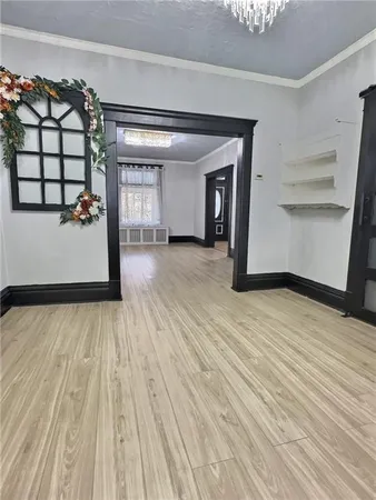 a view of a room with wooden floor and chair