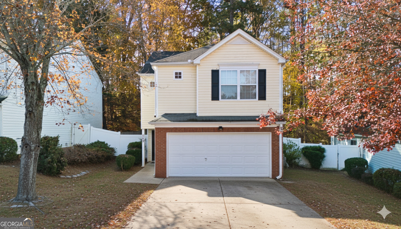a front view of a house with a garage