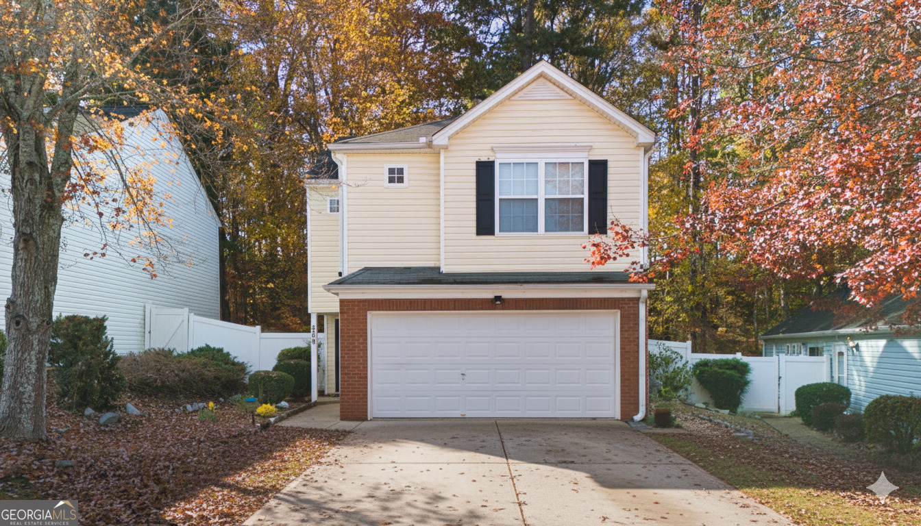 269 Silver Ridge Drive, Unit 269 Dallas, GA 30157 - Photo 2 of 34 a front view of a house with a yard and garage