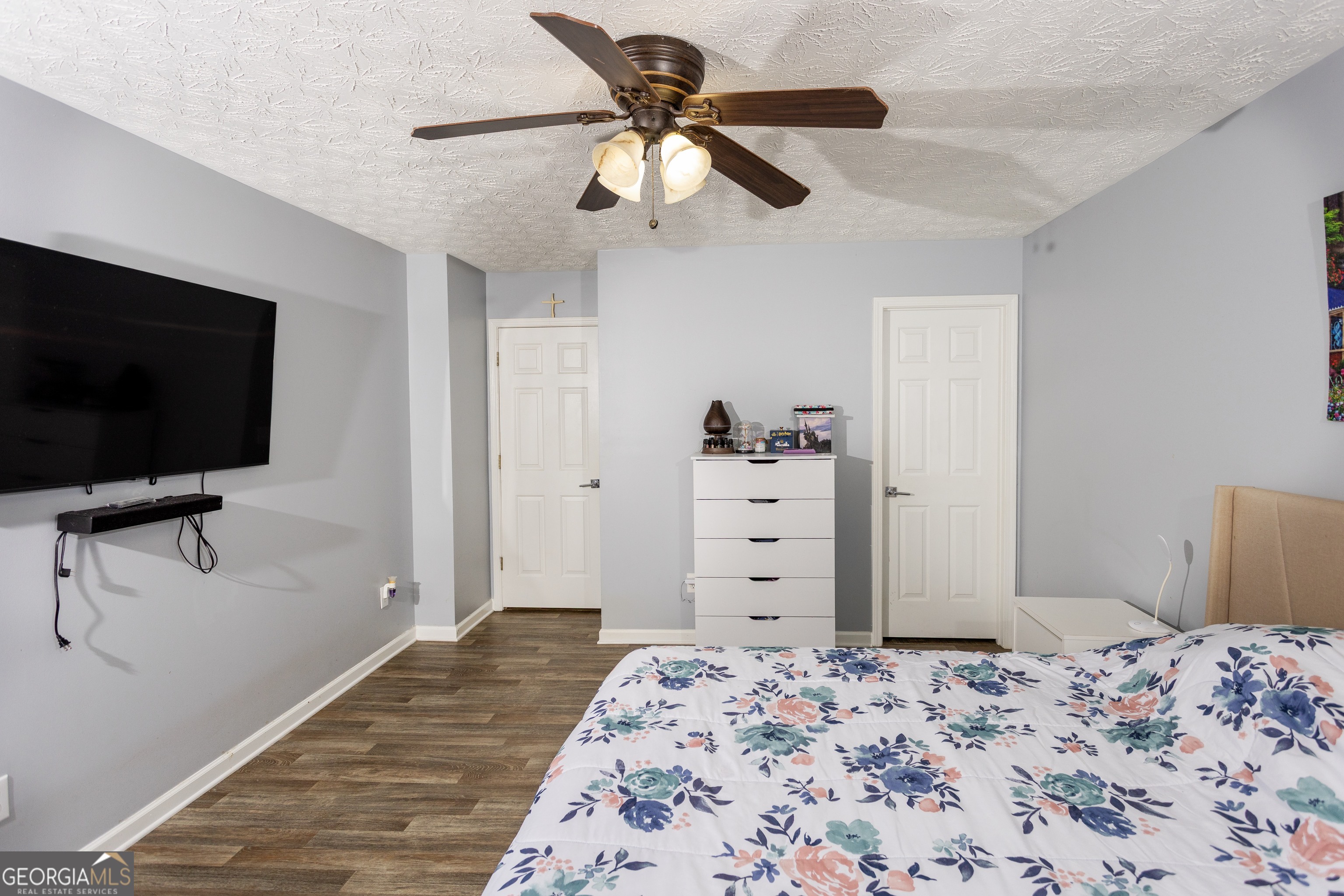 269 Silver Ridge Drive, Unit 269 Dallas, GA 30157 - Photo 22 of 34 a bedroom with a bed and a flat screen tv