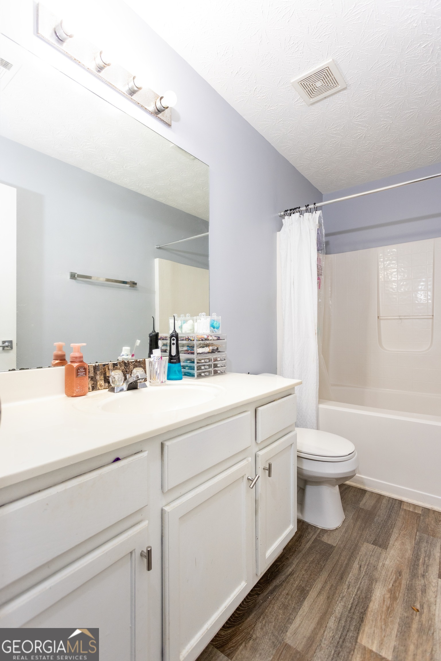269 Silver Ridge Drive, Unit 269 Dallas, GA 30157 - Photo 25 of 34 a bathroom with a double vanity sink toilet and shower