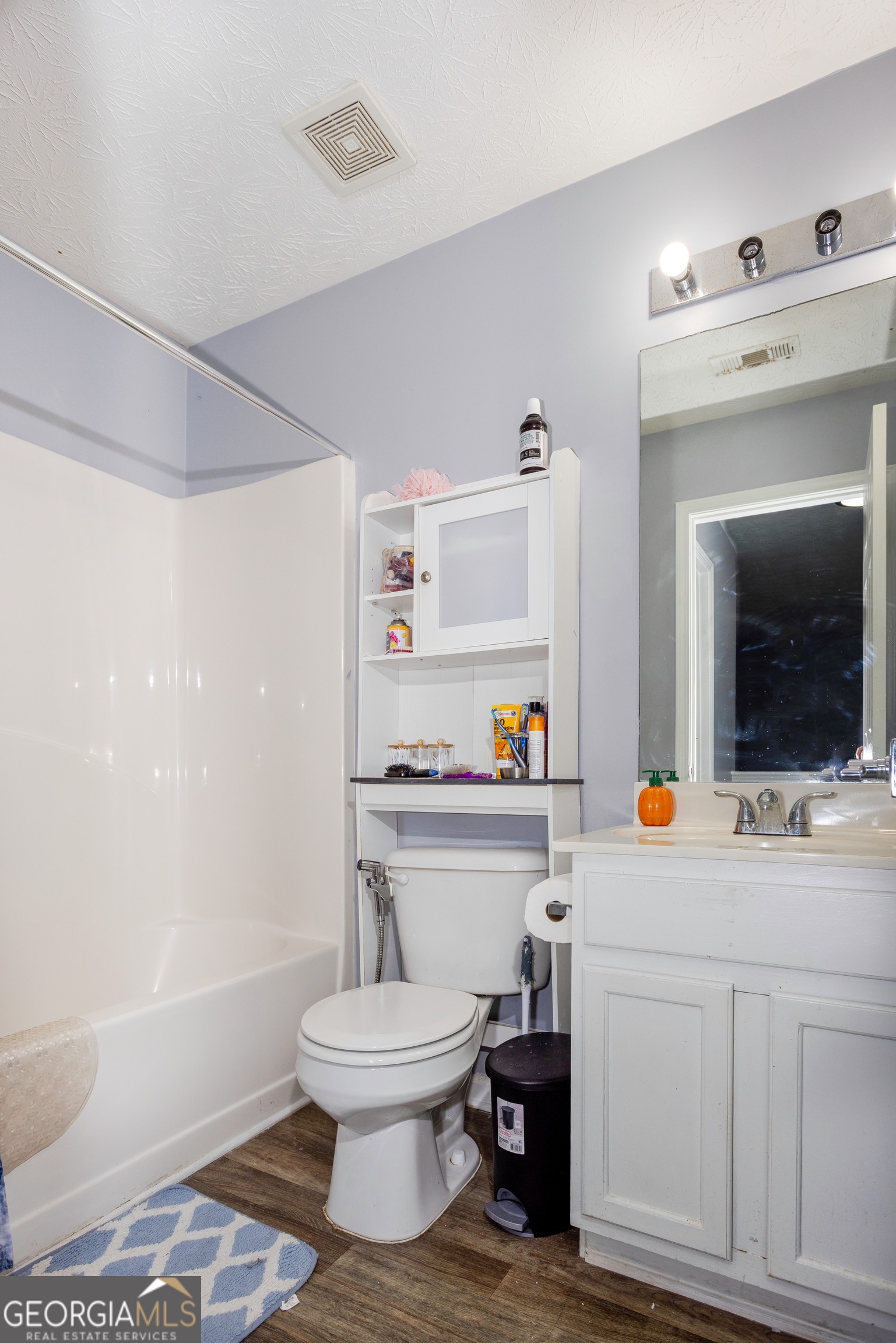 269 Silver Ridge Drive, Unit 269 Dallas, GA 30157 - Photo 31 of 34 a bathroom with a sink a toilet and shower