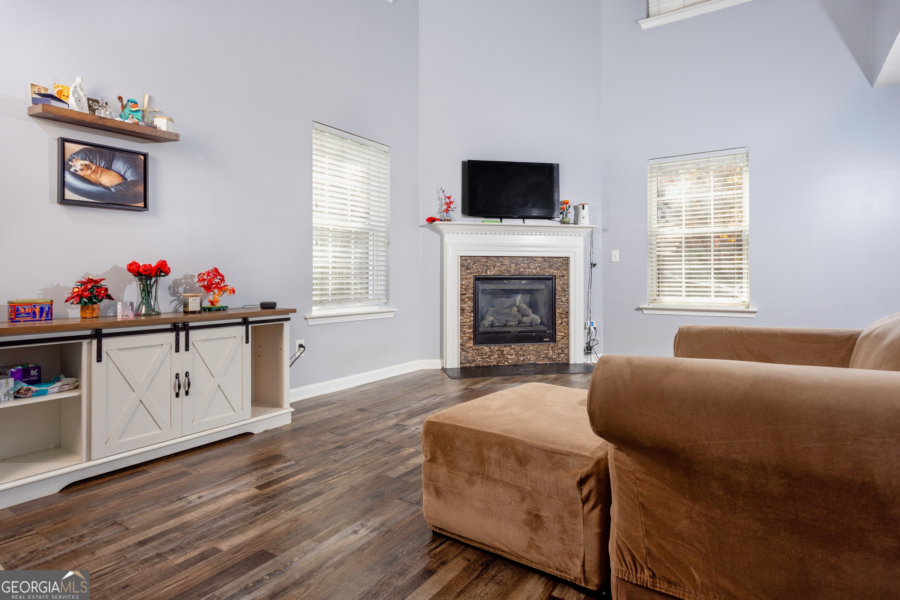 269 Silver Ridge Drive, Unit 269 Dallas, GA 30157 - Photo 9 of 34 a living room with furniture a flat screen tv and a fireplace