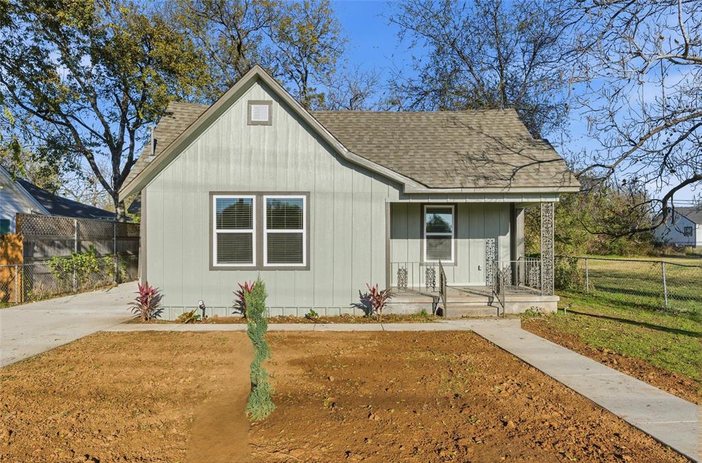 803 Garrison Street Waco, TX 76704 - Photo 1 of 16 a front view of a house with a yard and potted plants