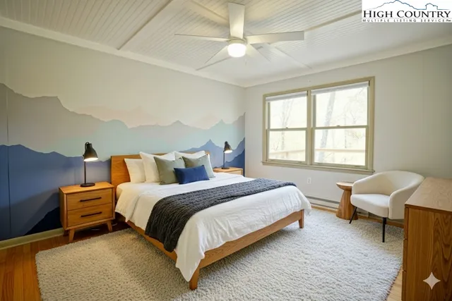 a bedroom with bed and a window