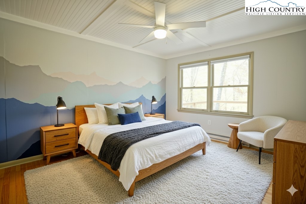 1028 Charter Hills Road Beech Mountain, NC 28604 - Photo 16 of 25 a bedroom with bed and a window