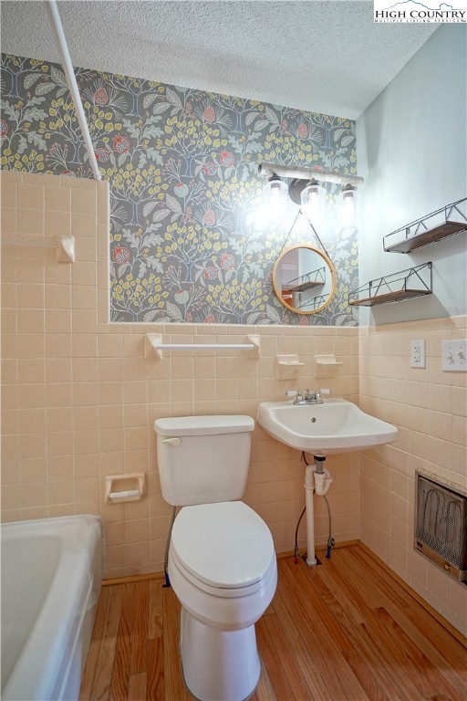 1028 Charter Hills Road Beech Mountain, NC 28604 - Photo 21 of 25 a bathroom with a sink a toilet and a mirror
