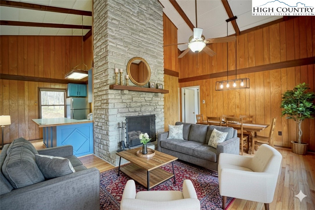 1028 Charter Hills Road Beech Mountain, NC 28604 - Photo 5 of 25 a living room with furniture and a fireplace