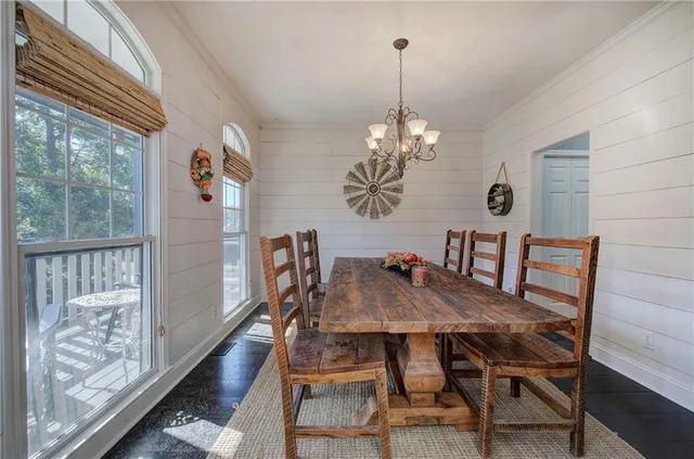 a living room with fireplace furniture and a wooden floor