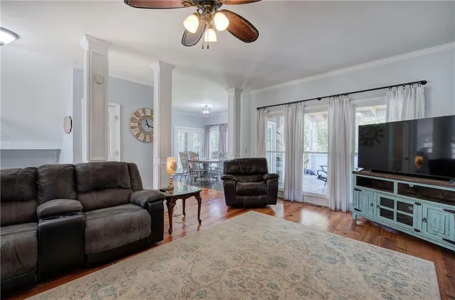 a view of a dining room with furniture window and wooden floor