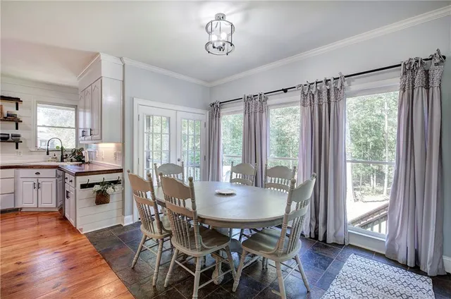 a kitchen with stainless steel appliances granite countertop a sink and cabinets