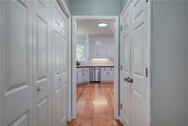 a living room with furniture a fireplace and a large window