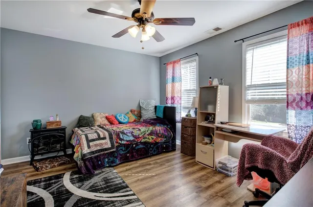 a bathroom with a tub a sink and a shower