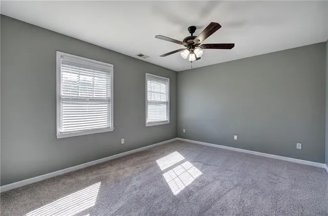 a bathroom with a light fixture and a sink
