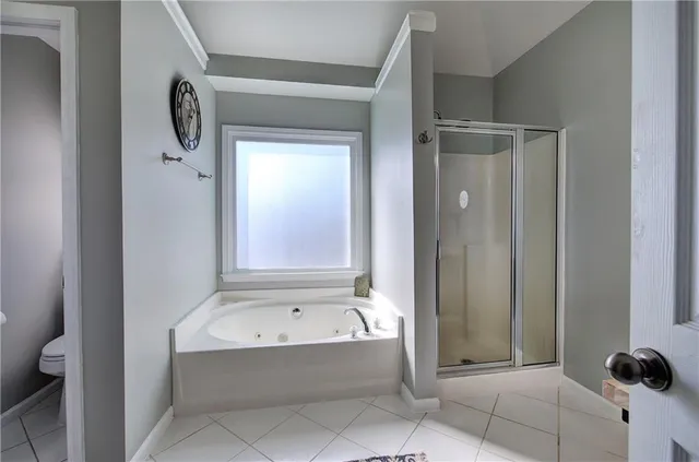 a view of a hallway with wooden floor and stairs