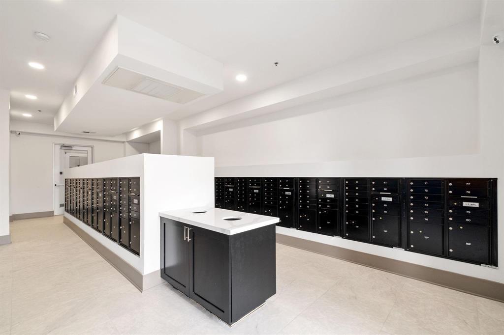 2700 Old Denton Road, Unit 3370 Carrollton, TX 75007 - Photo 6 of 9 a large kitchen with a counter top space and stainless steel appliances