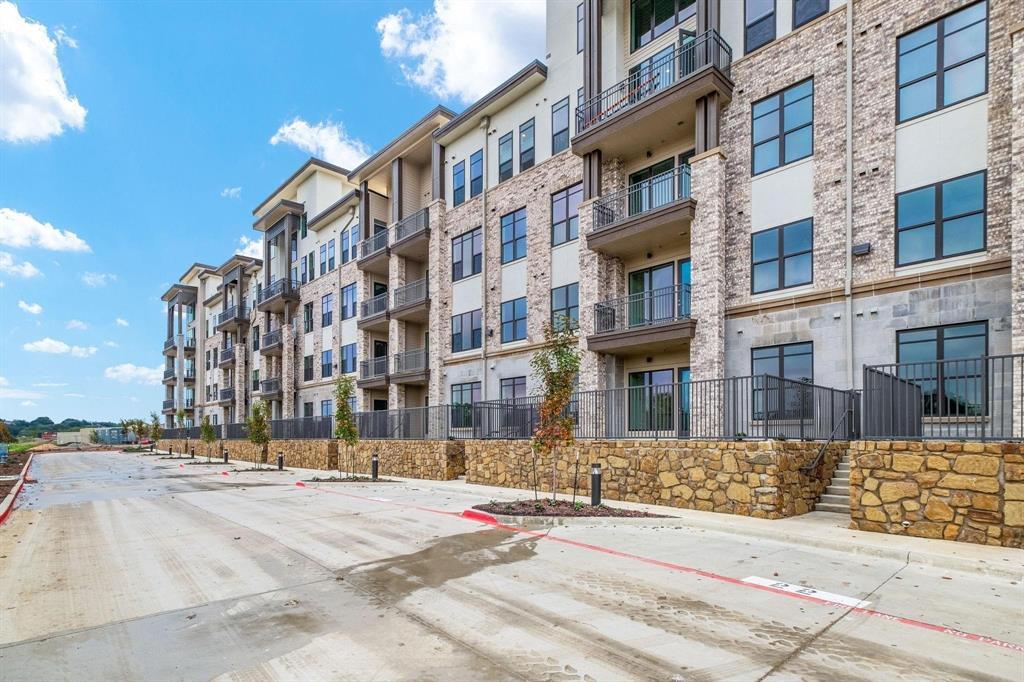 2700 Old Denton Road, Unit 3370 Carrollton, TX 75007 - Photo 7 of 9 a street view along with residential building