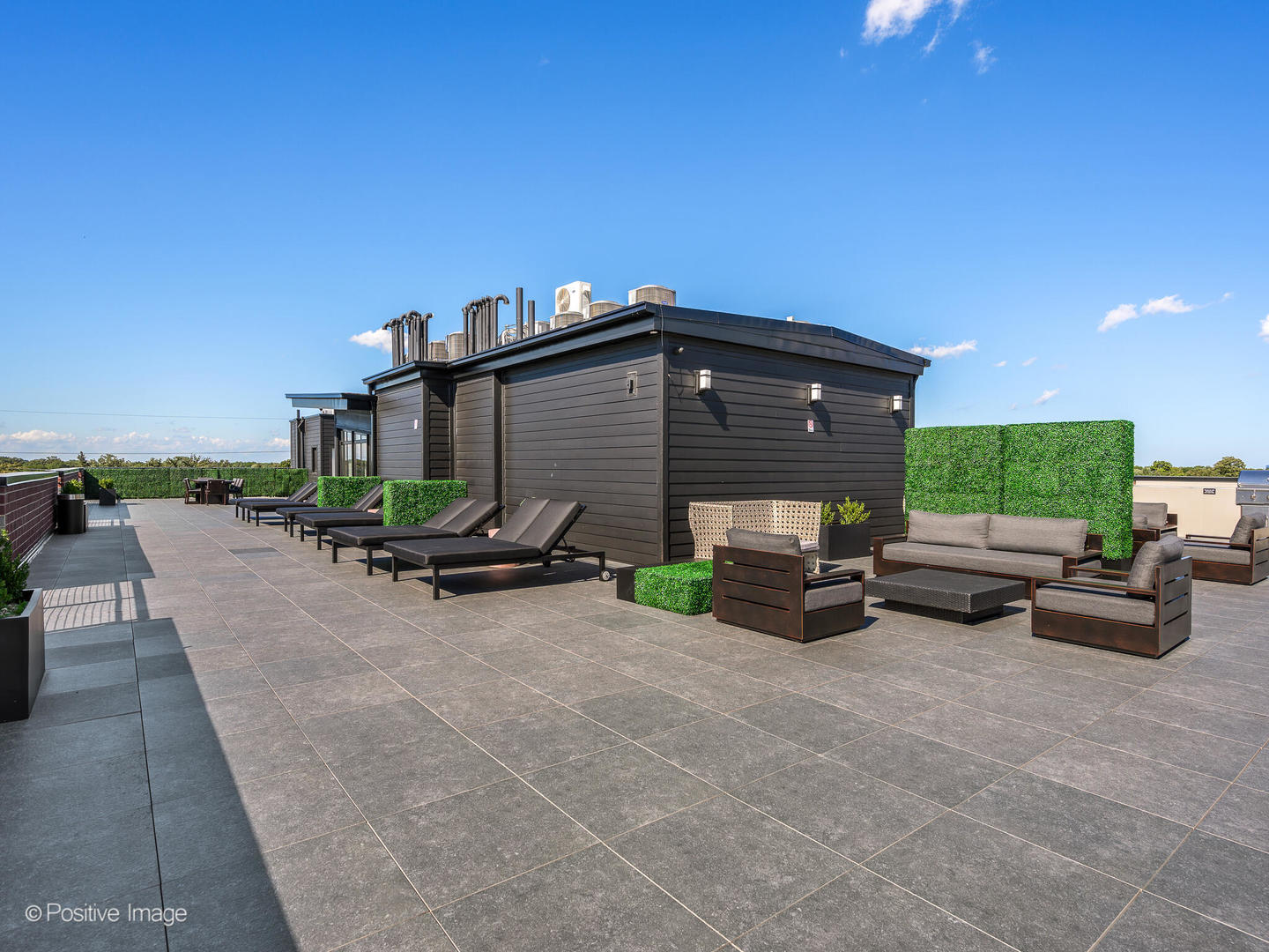 2811 Thatcher Avenue, Unit 301 River Grove, IL 60171 - Photo 38 of 44 a view of a patio with a table and chairs under an umbrella