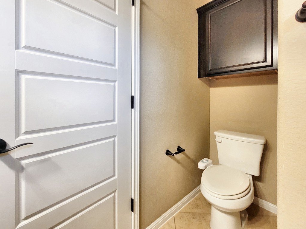 7508 Colina Vista Loop, Unit B Austin, TX 78750 - Photo 14 of 40 a bathroom with a toilet and a sink