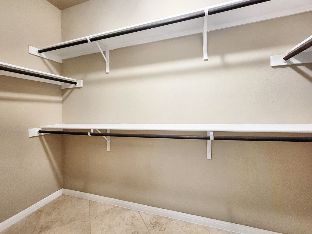 7508 Colina Vista Loop, Unit B Austin, TX 78750 - Photo 19 of 40 a view of a room with racks on the wall