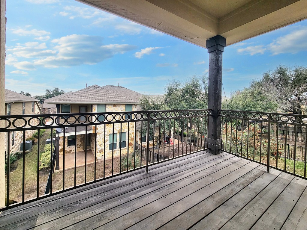 7508 Colina Vista Loop, Unit B Austin, TX 78750 - Photo 20 of 40 a view of a balcony with wooden floor