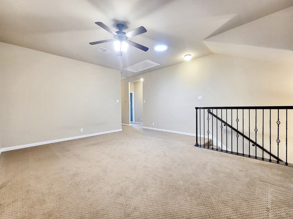 7508 Colina Vista Loop, Unit B Austin, TX 78750 - Photo 21 of 40 a view of an empty room with a chandelier fan