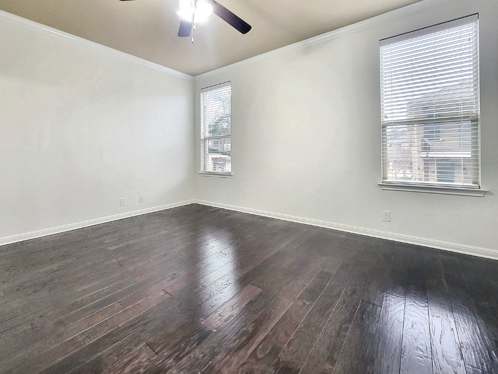 7508 Colina Vista Loop, Unit B Austin, TX 78750 - Photo 22 of 40 a view of an empty room with wooden floor and a window
